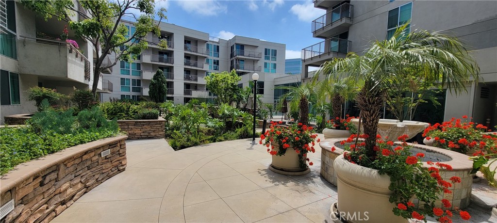 267 San Pedro Street Los Angeles, CA 90012 - Photo 12 of 24 a view of a patio with plants and chairs and flower plants