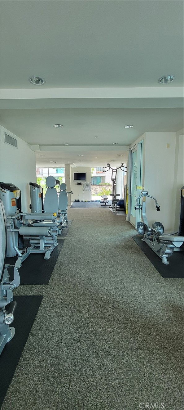 267 San Pedro Street Los Angeles, CA 90012 - Photo 15 of 24 a room with gym equipment and a large window