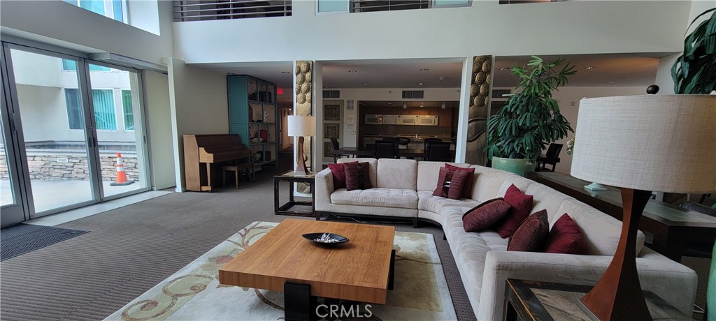 267 San Pedro Street Los Angeles, CA 90012 - Photo 18 of 24 a living room with furniture and a flat screen tv