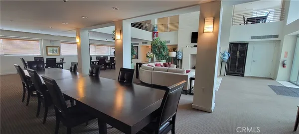 a kitchen with a table chairs stove and microwave