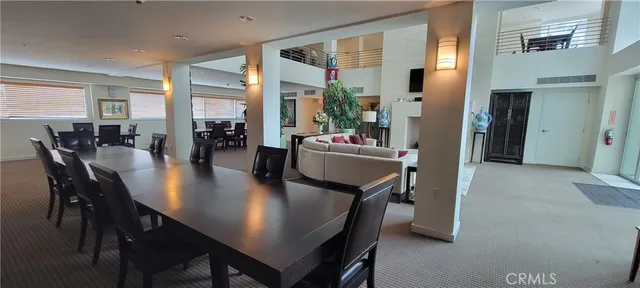 a kitchen with a table chairs stove and microwave