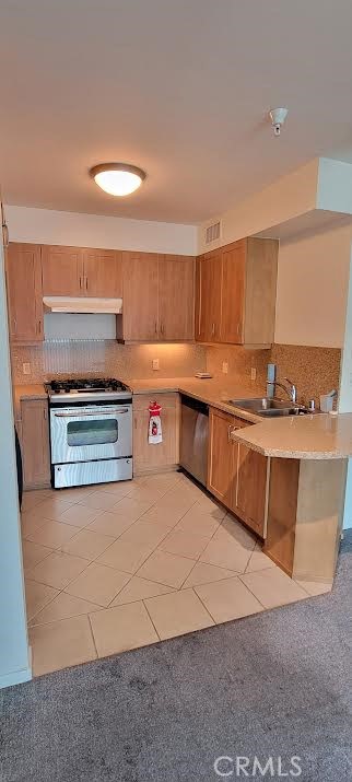 267 San Pedro Street Los Angeles, CA 90012 - Photo 2 of 24 a kitchen with stainless steel appliances granite countertop a stove a sink and a refrigerator