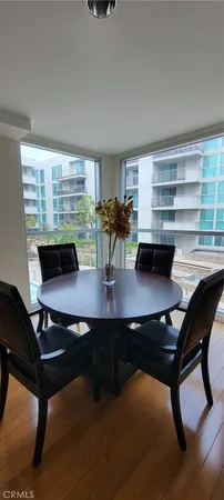 a room with furniture pool table and window
