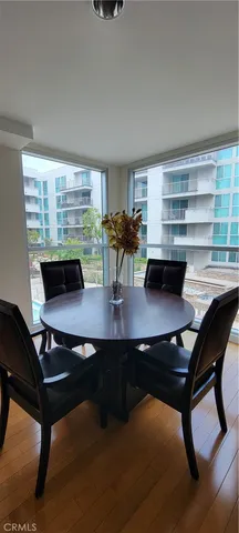 a room with furniture pool table and window