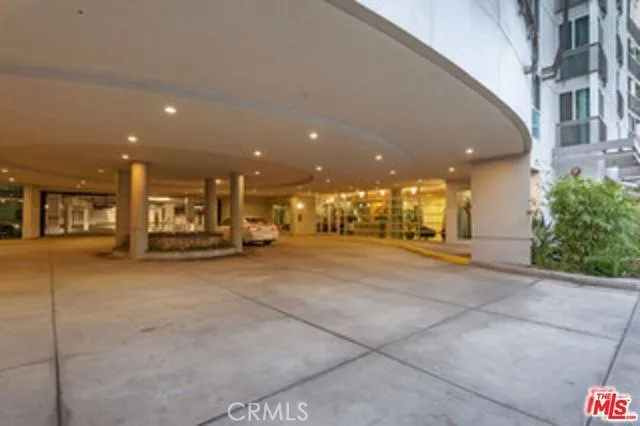 a lobby with furniture and floor to ceiling window
