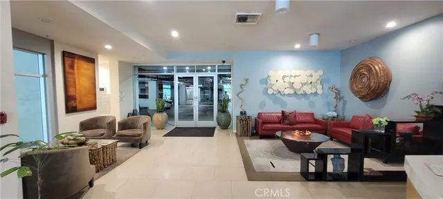 a view of a patio with plants and couches