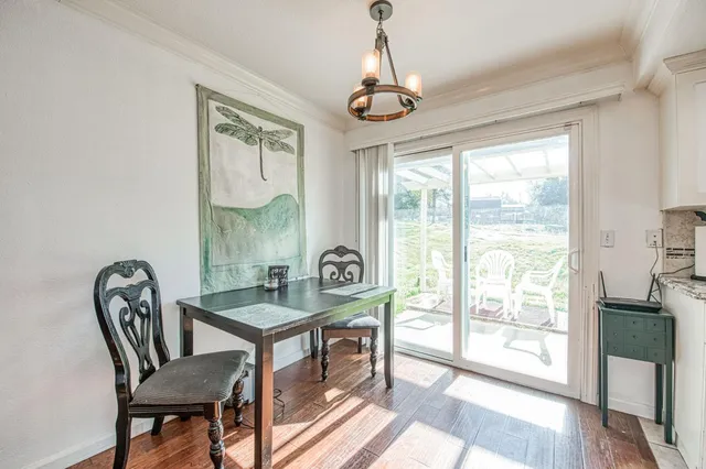 a bathroom with a sink a toilet a mirror and shower