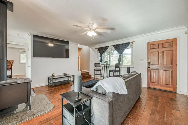 a kitchen with kitchen island granite countertop a sink appliances cabinets and a counter top space