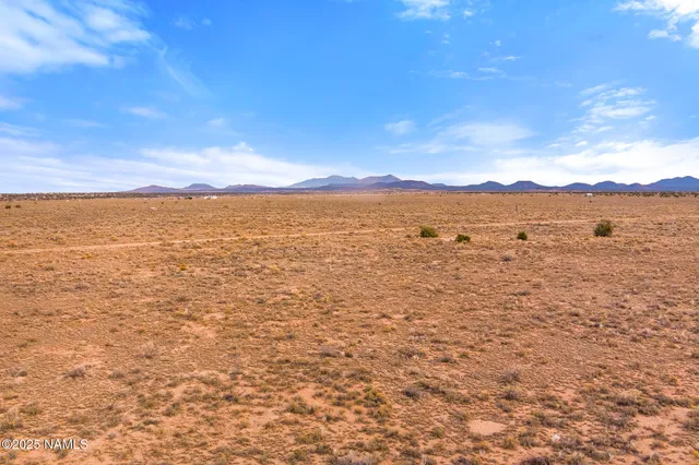 a view of an ocean from a mountain