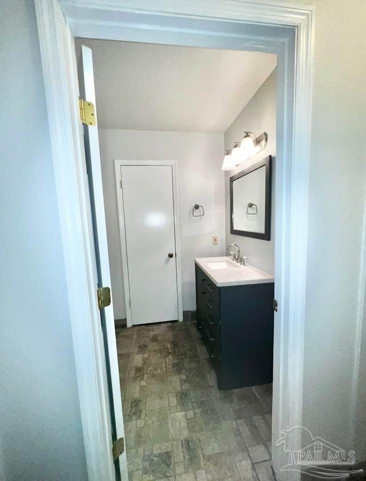 5705 Admiral Doyle Road Pensacola, FL 32506 - Photo 12 of 32 a bathroom with a sink and mirror
