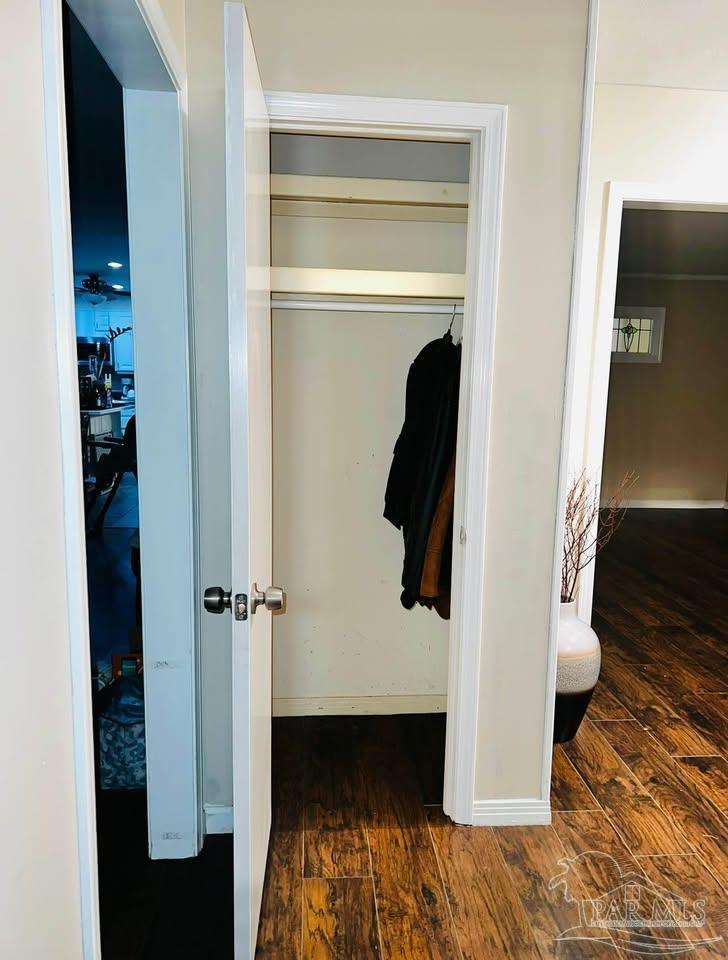 5705 Admiral Doyle Road Pensacola, FL 32506 - Photo 18 of 32 a view of walk in closet with clothes and shoes