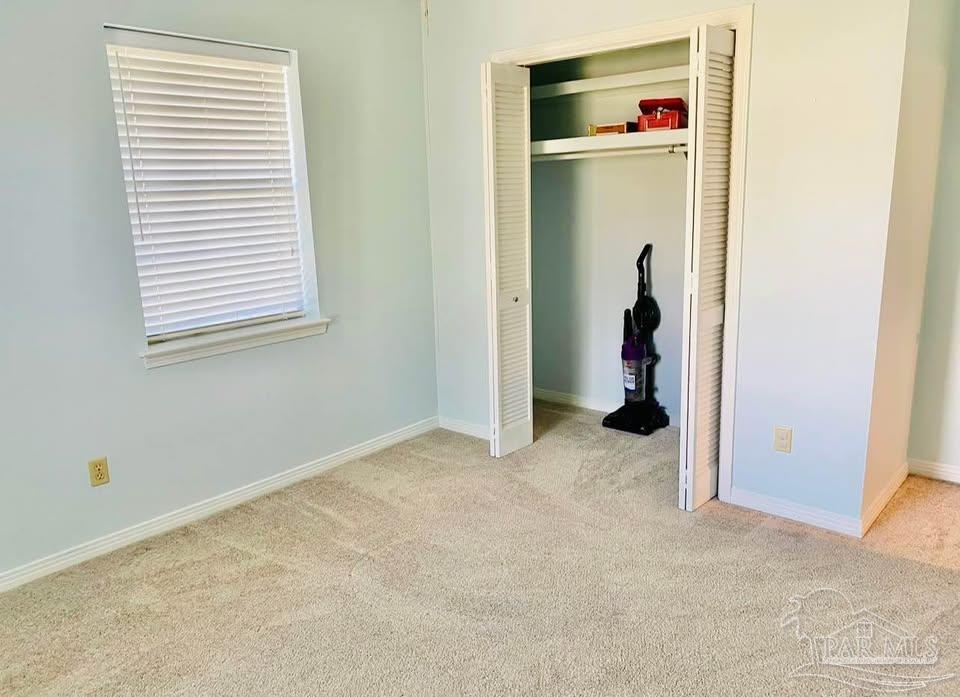 5705 Admiral Doyle Road Pensacola, FL 32506 - Photo 23 of 32 a view of an empty room with closet and a window