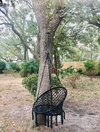 a view of a kitchen with kitchen island granite countertop a refrigerator and a stove top oven