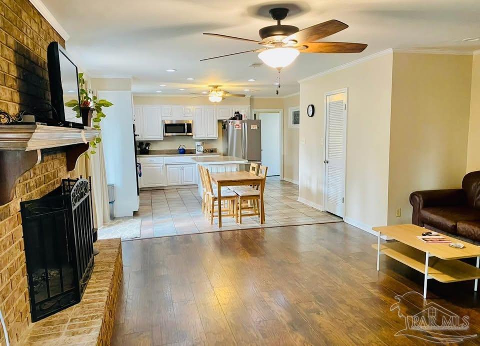 5705 Admiral Doyle Road Pensacola, FL 32506 - Photo 3 of 32 a living room with furniture and a fireplace