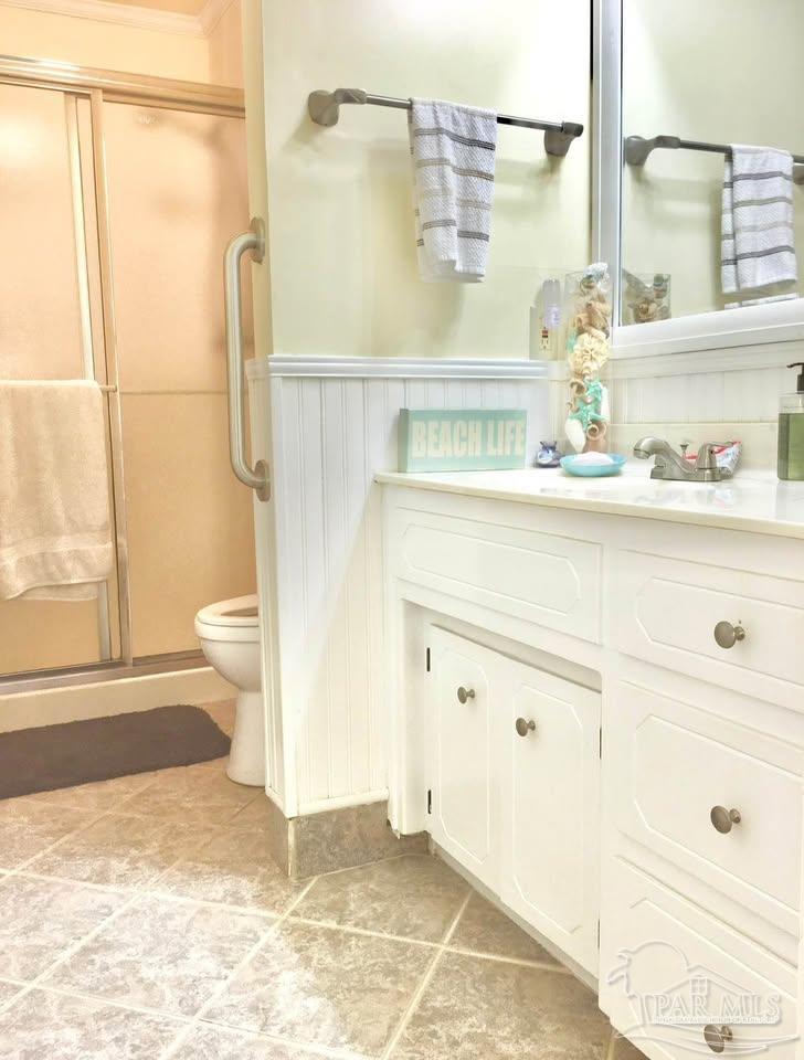 5705 Admiral Doyle Road Pensacola, FL 32506 - Photo 6 of 32 a bathroom with a sink and a mirror