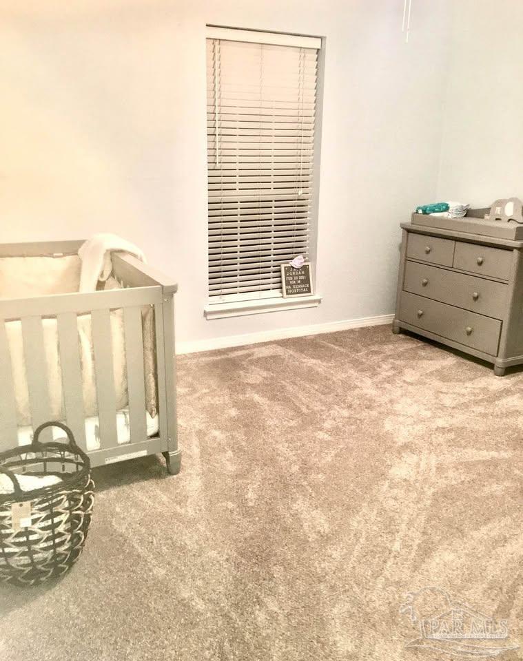 5705 Admiral Doyle Road Pensacola, FL 32506 - Photo 7 of 32 a view of a livingroom with wooden floor and a window
