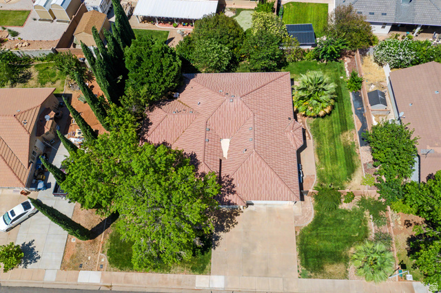 3034 Swiss Drive Santa Clara, UT 84765 - Photo 58 of 59 Aerial perspective showcasing a single-story residence with a brown tile roof and an attached garage