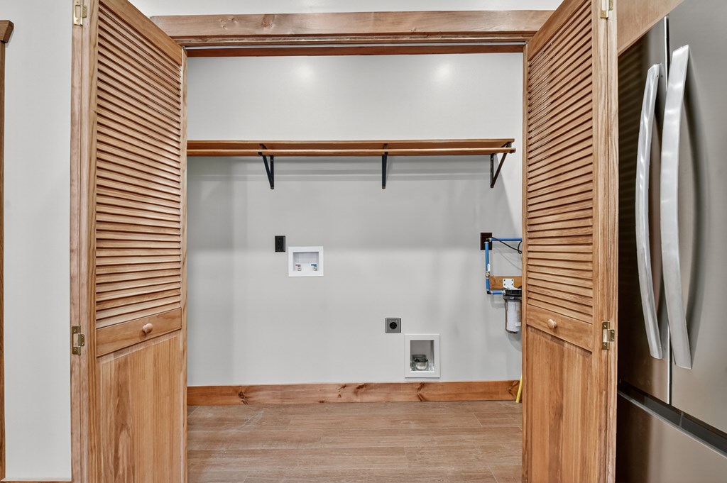 524 Old Highway Blue Ridge, GA 30513 - Photo 15 of 34 a view of a refrigerator in kitchen and an empty room