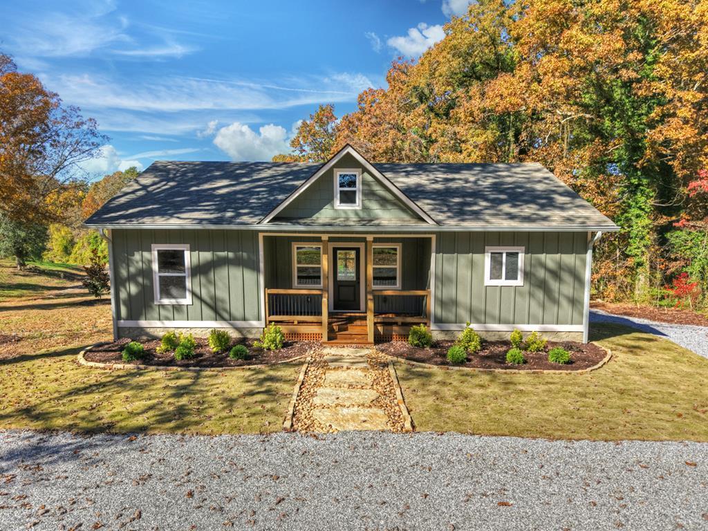 524 Old Highway Blue Ridge, GA 30513 - Photo 2 of 34 a front view of a house with swimming pool and glass windows