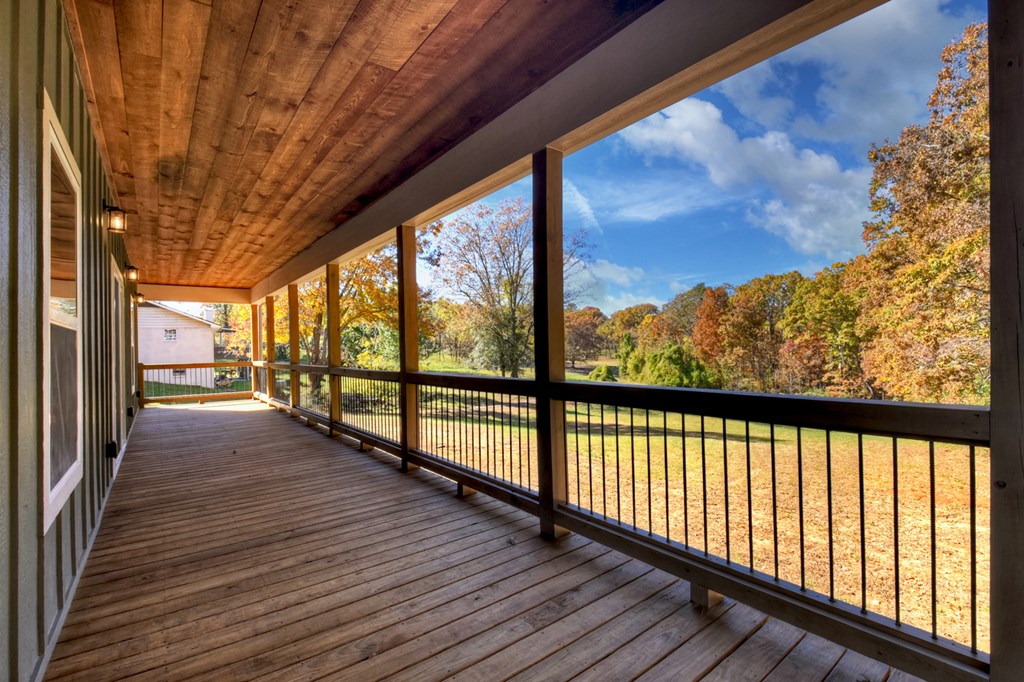 524 Old Highway Blue Ridge, GA 30513 - Photo 26 of 34 a view of a porch with wooden floor and outdoor seating