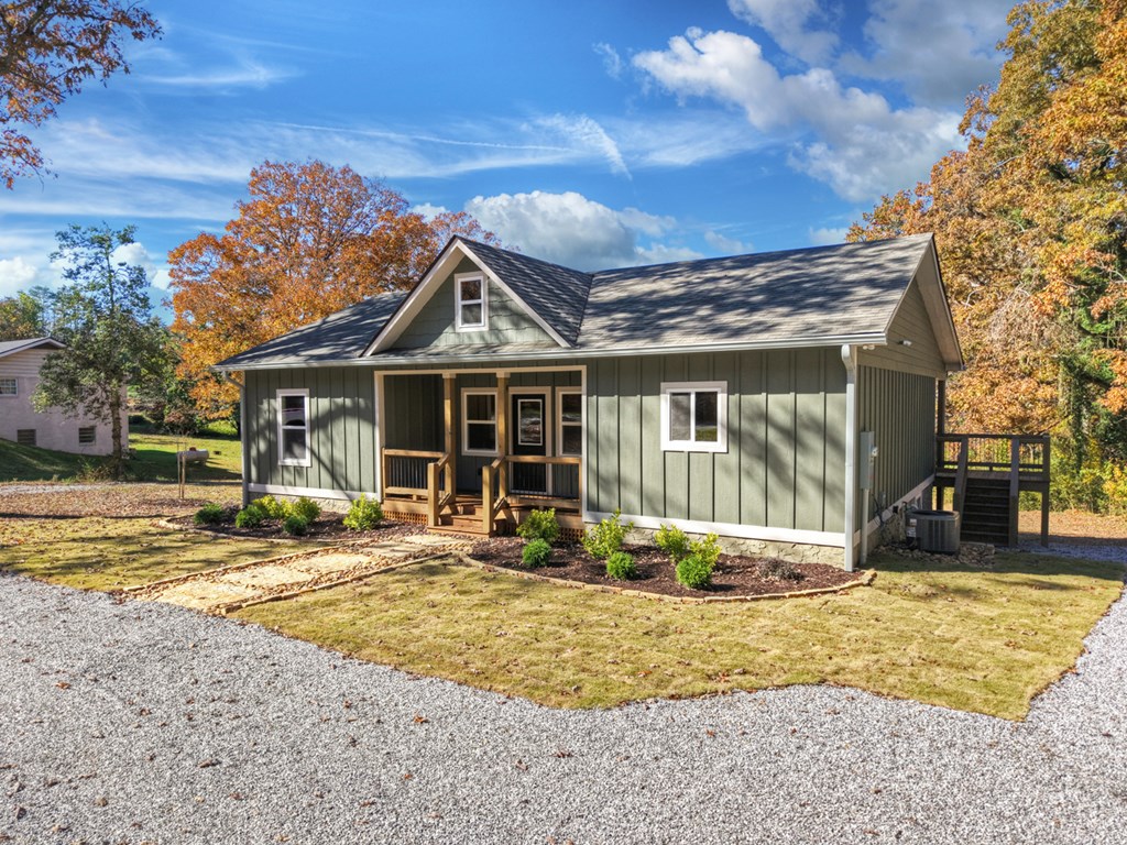 524 Old Highway Blue Ridge, GA 30513 - Photo 30 of 34 a front view of a house with a yard outdoor seating and covered with trees