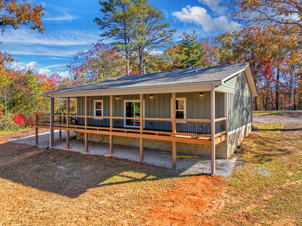 524 Old Highway Blue Ridge, GA 30513 - Photo 31 of 34 a view of a house with a wooden deck and a backyard