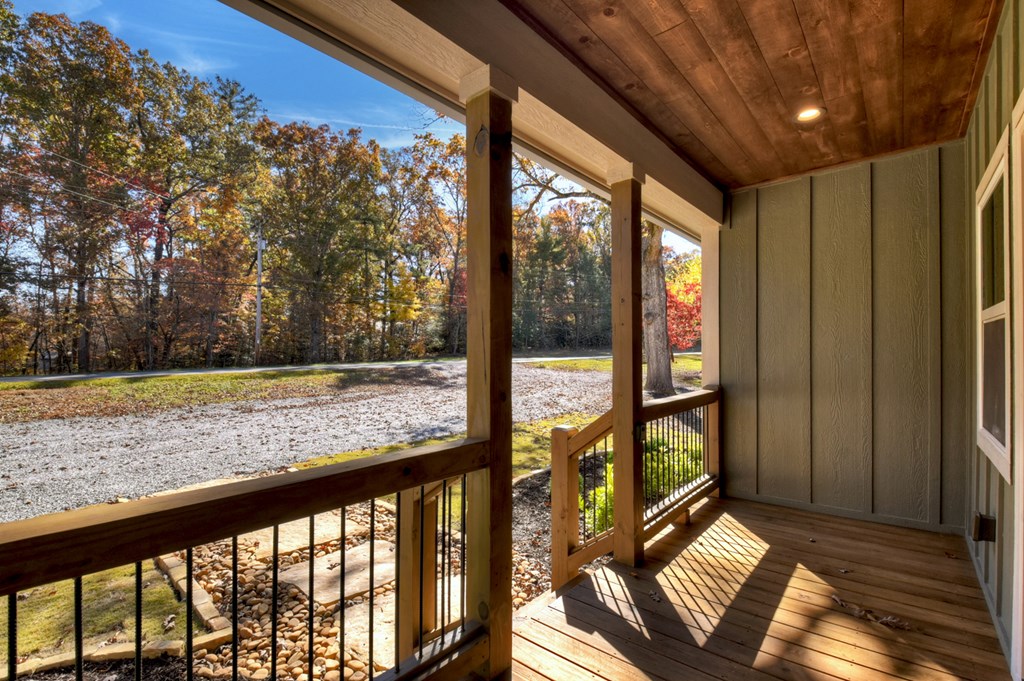 524 Old Highway Blue Ridge, GA 30513 - Photo 4 of 34 a view of a porch with wooden floor and outdoor space
