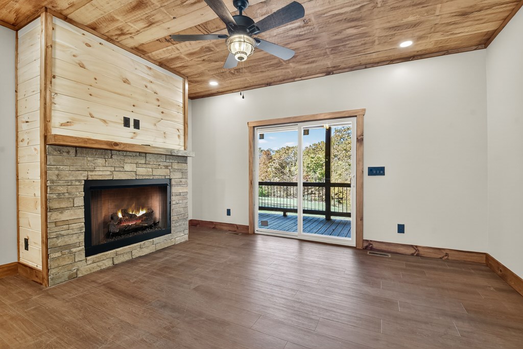 524 Old Highway Blue Ridge, GA 30513 - Photo 6 of 34 a view of an empty room with a fireplace and a window