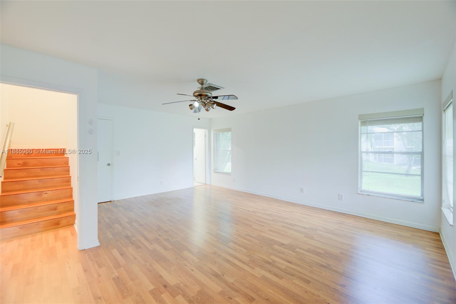 8662 Bridle Path Court, Unit 115A Davie, FL 33328 - Photo 23 of 50 wooden floor in an empty room with a window