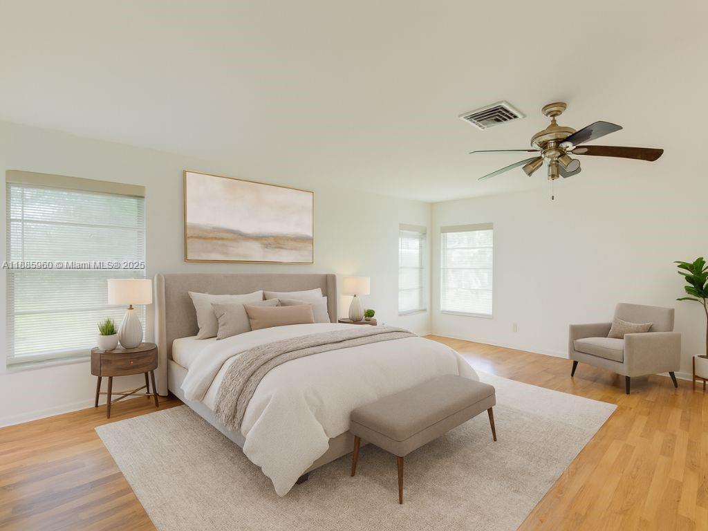 8662 Bridle Path Court, Unit 115A Davie, FL 33328 - Photo 24 of 50 a bedroom with a bed furniture and a window