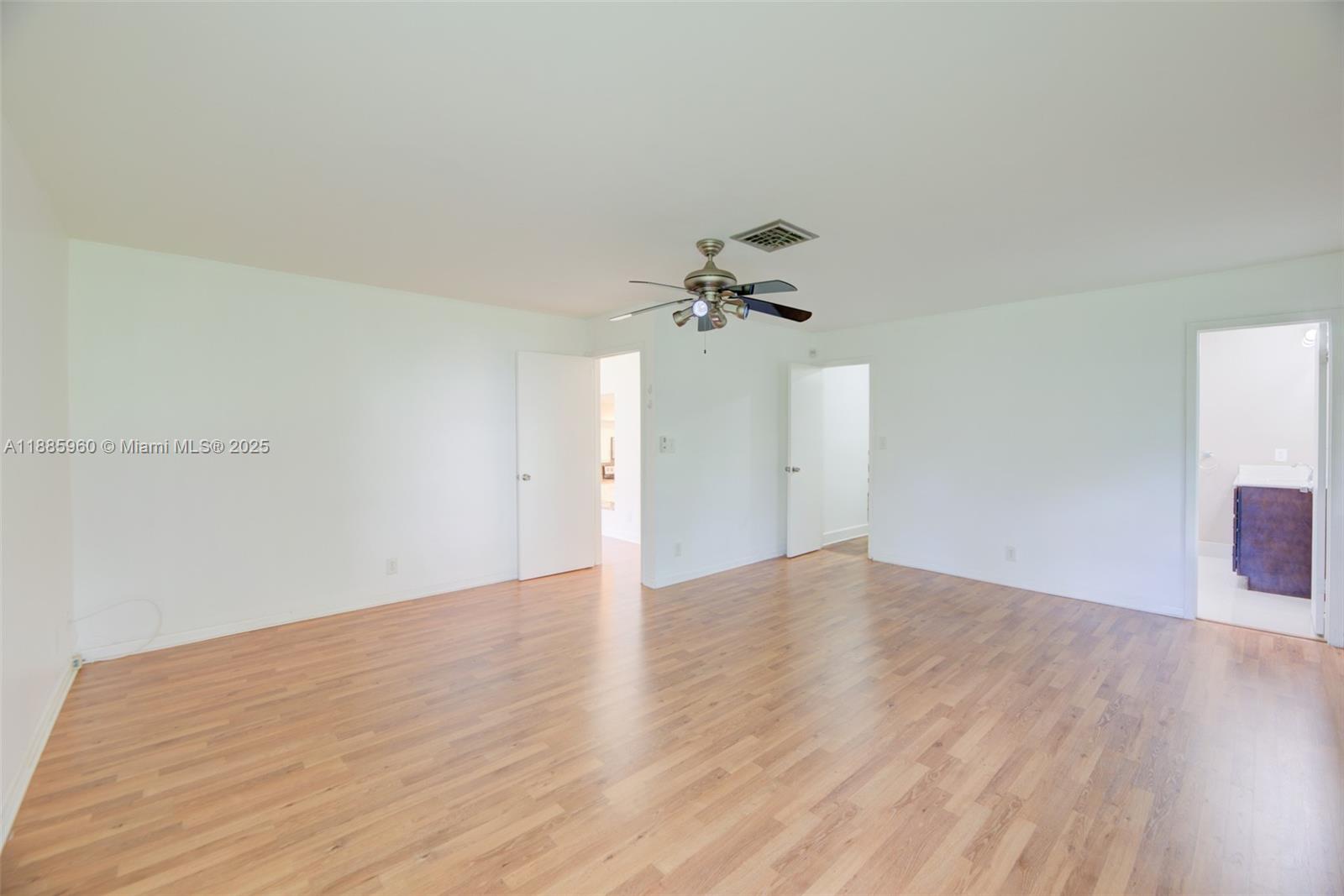 8662 Bridle Path Court, Unit 115A Davie, FL 33328 - Photo 26 of 50 a view of empty room with wooden floor