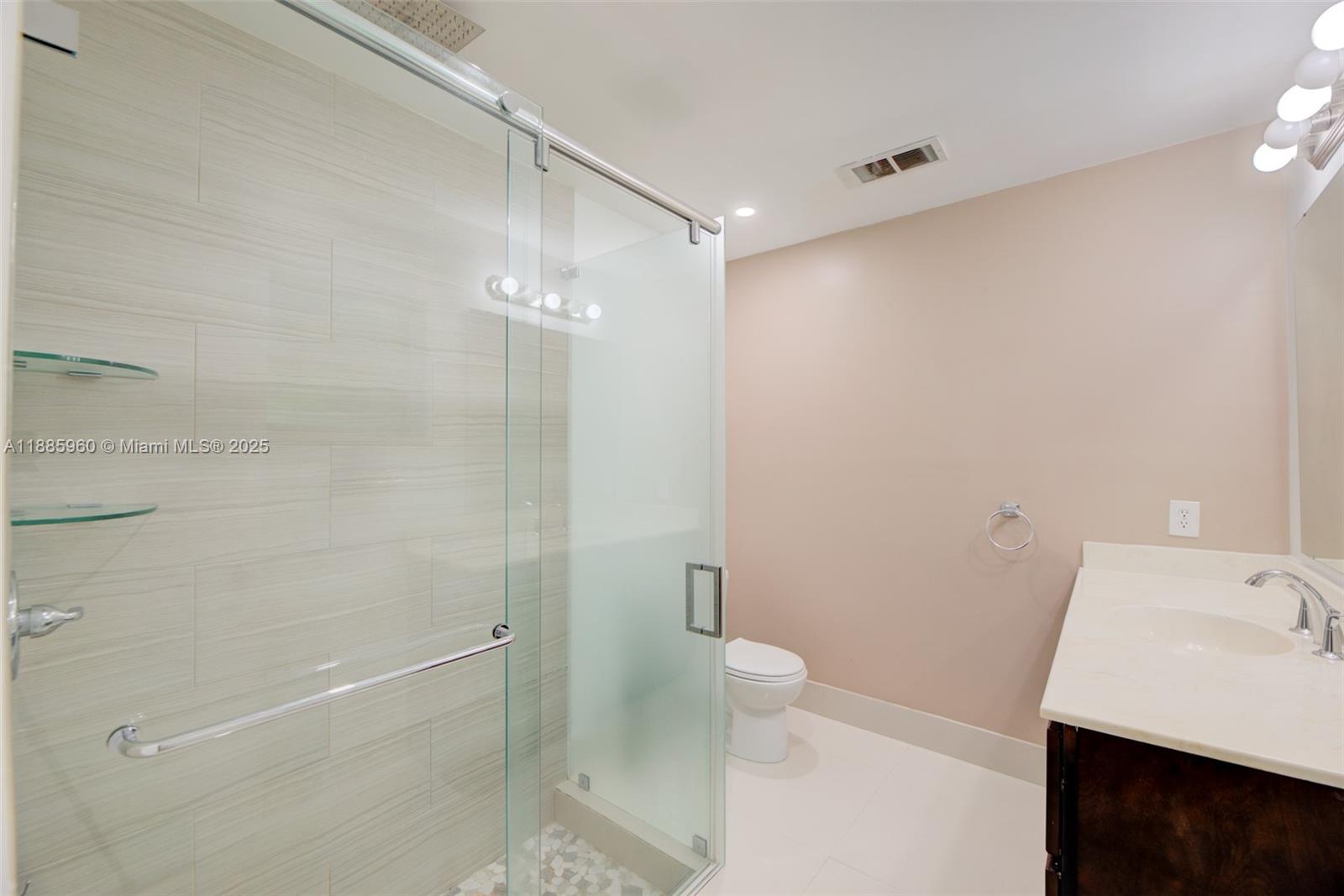 8662 Bridle Path Court, Unit 115A Davie, FL 33328 - Photo 27 of 50 a bathroom with a sink and a mirror