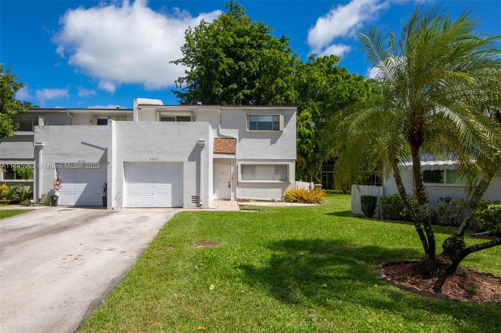 8662 Bridle Path Court, Unit 115A Davie, FL 33328 - Photo 3 of 50 a view of a house with a yard and sitting area