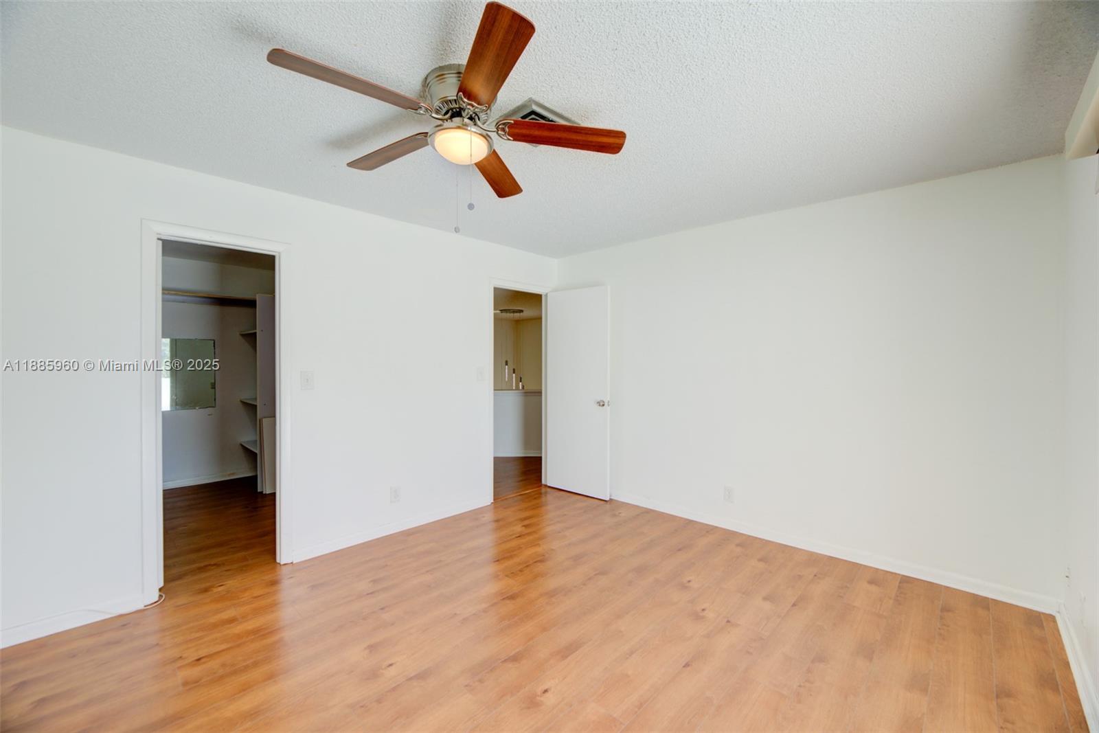 8662 Bridle Path Court, Unit 115A Davie, FL 33328 - Photo 32 of 50 wooden floor in an empty room
