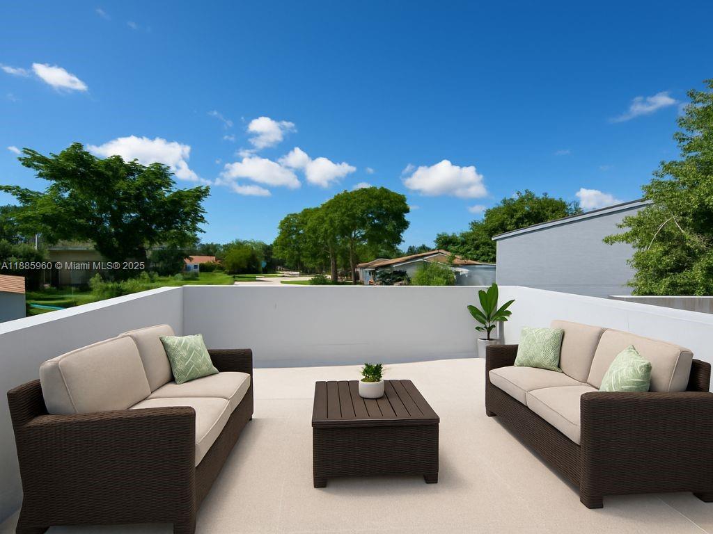 8662 Bridle Path Court, Unit 115A Davie, FL 33328 - Photo 33 of 50 a roof deck with couches and sky view
