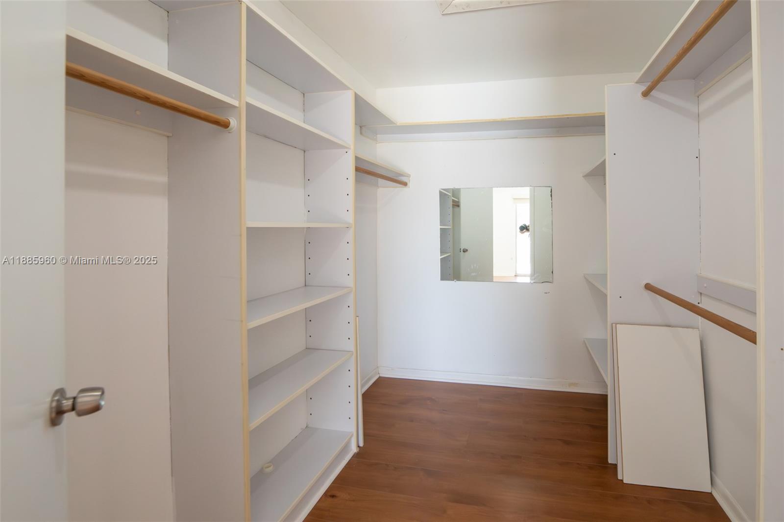 8662 Bridle Path Court, Unit 115A Davie, FL 33328 - Photo 35 of 50 a view of walk in closet with empty racks