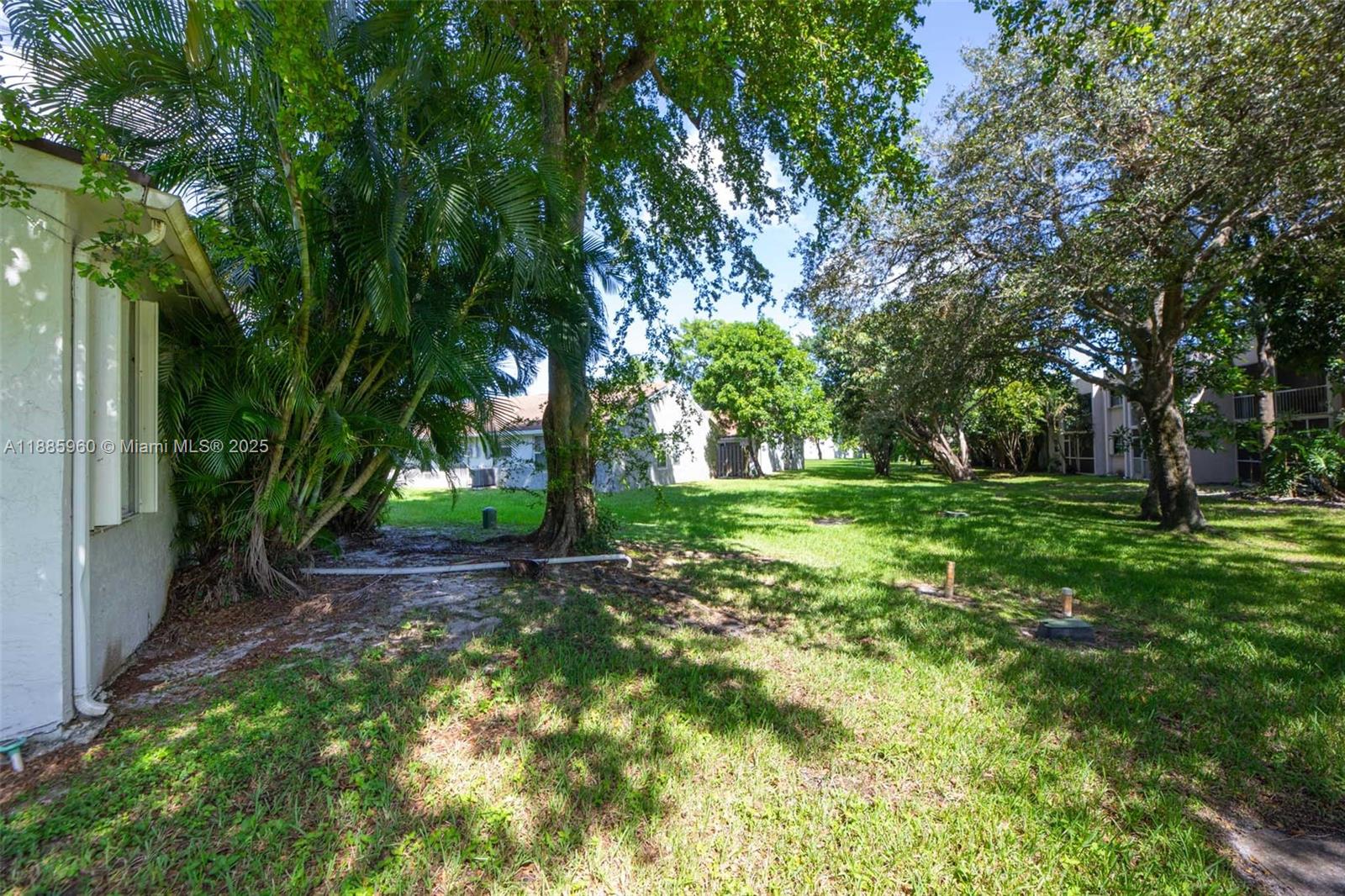 8662 Bridle Path Court, Unit 115A Davie, FL 33328 - Photo 43 of 50 a view of green field with trees in the background