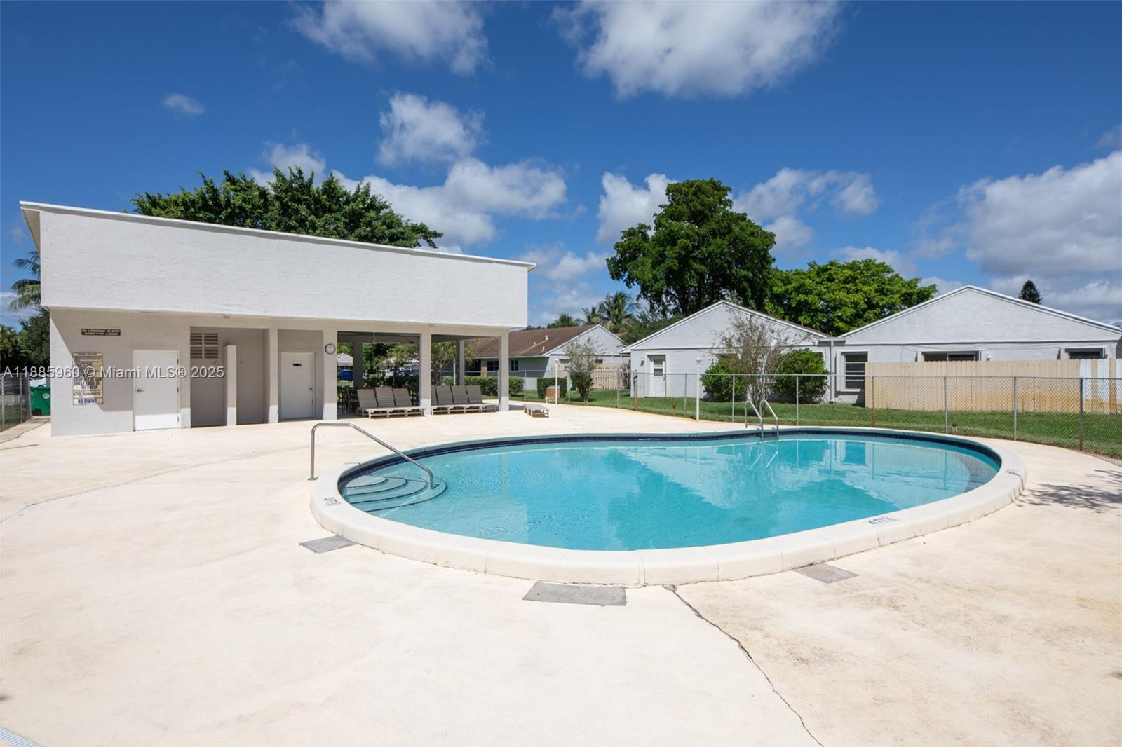 8662 Bridle Path Court, Unit 115A Davie, FL 33328 - Photo 46 of 50 a view of outdoor space yard and swimming pool