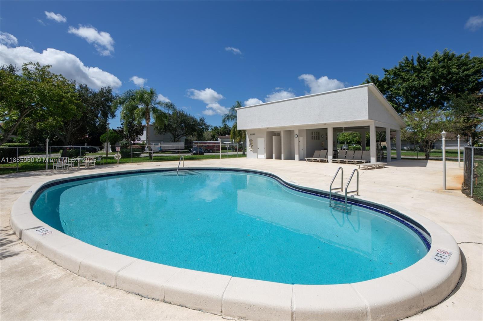 8662 Bridle Path Court, Unit 115A Davie, FL 33328 - Photo 47 of 50 a view of a house with swimming pool