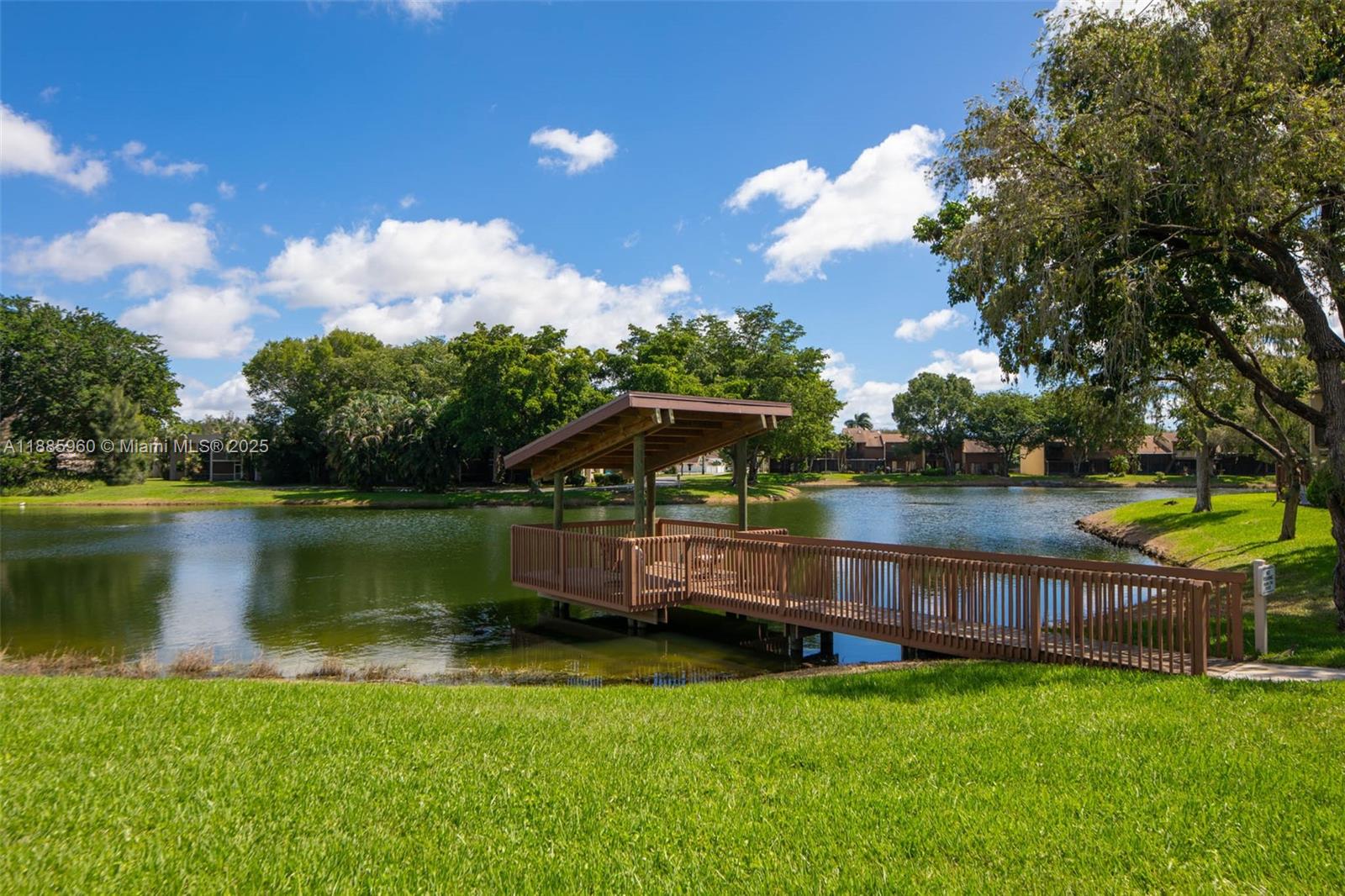 8662 Bridle Path Court, Unit 115A Davie, FL 33328 - Photo 48 of 50 a view of a house with a yard