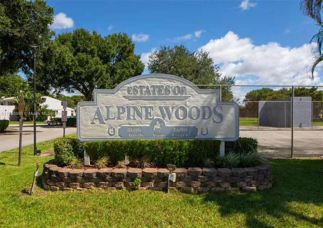a view of a park that has a sign board