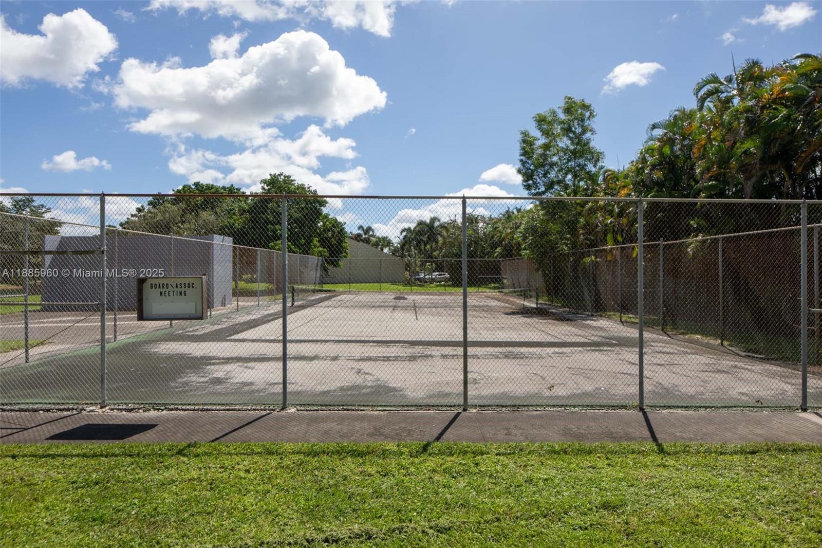 8662 Bridle Path Court, Unit 115A Davie, FL 33328 - Photo 50 of 50 a backyard of a house with a table and chairs