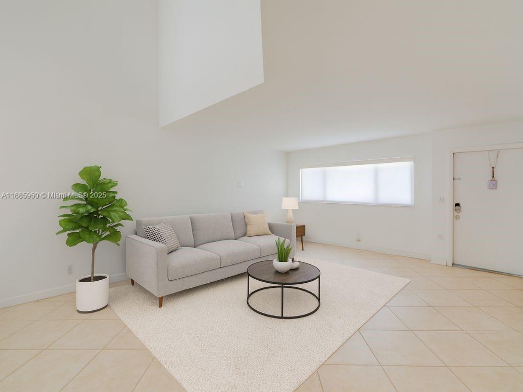 8662 Bridle Path Court, Unit 115A Davie, FL 33328 - Photo 6 of 50 a living room with furniture and a potted plant