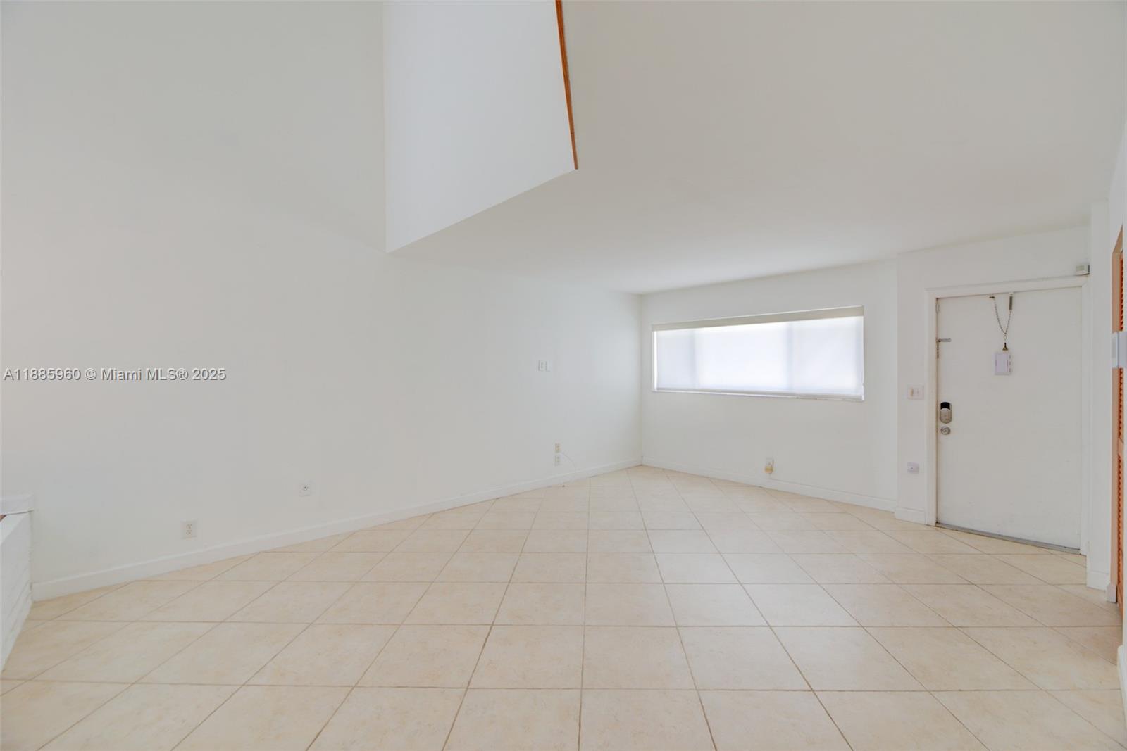 8662 Bridle Path Court, Unit 115A Davie, FL 33328 - Photo 7 of 50 a view of an empty room and a window