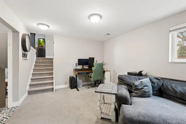 a bedroom with furniture and a window