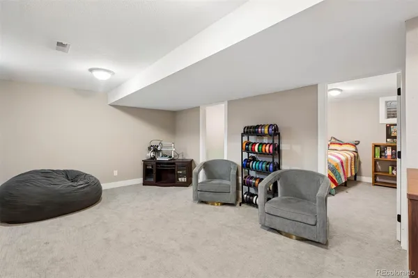 a bedroom with furniture and a couch