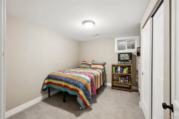 a bedroom with a bed and a closet