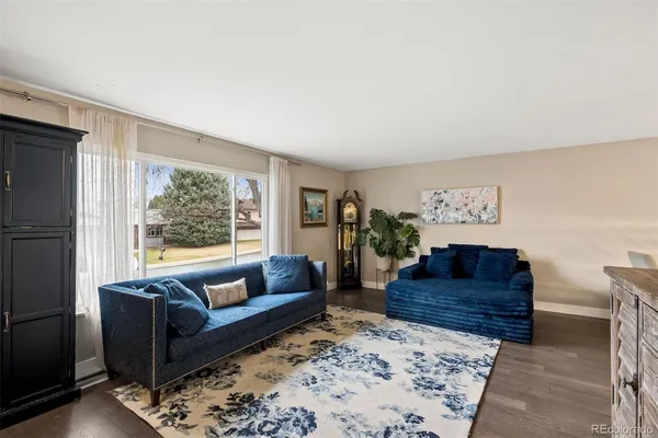a living room with couch and a rug