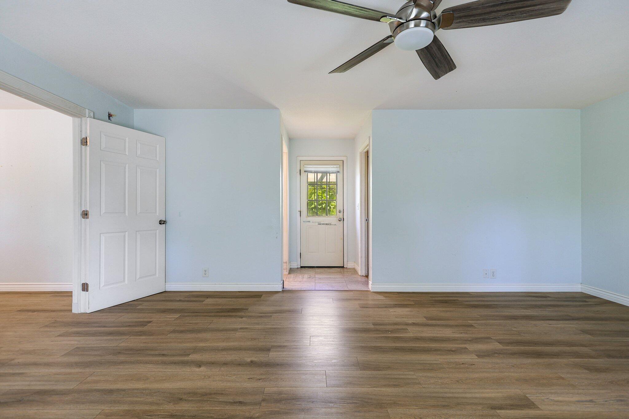 20727 Old Alturas Road Redding, CA 96003 - Photo 15 of 32 a view of a room with wooden floor and white walls