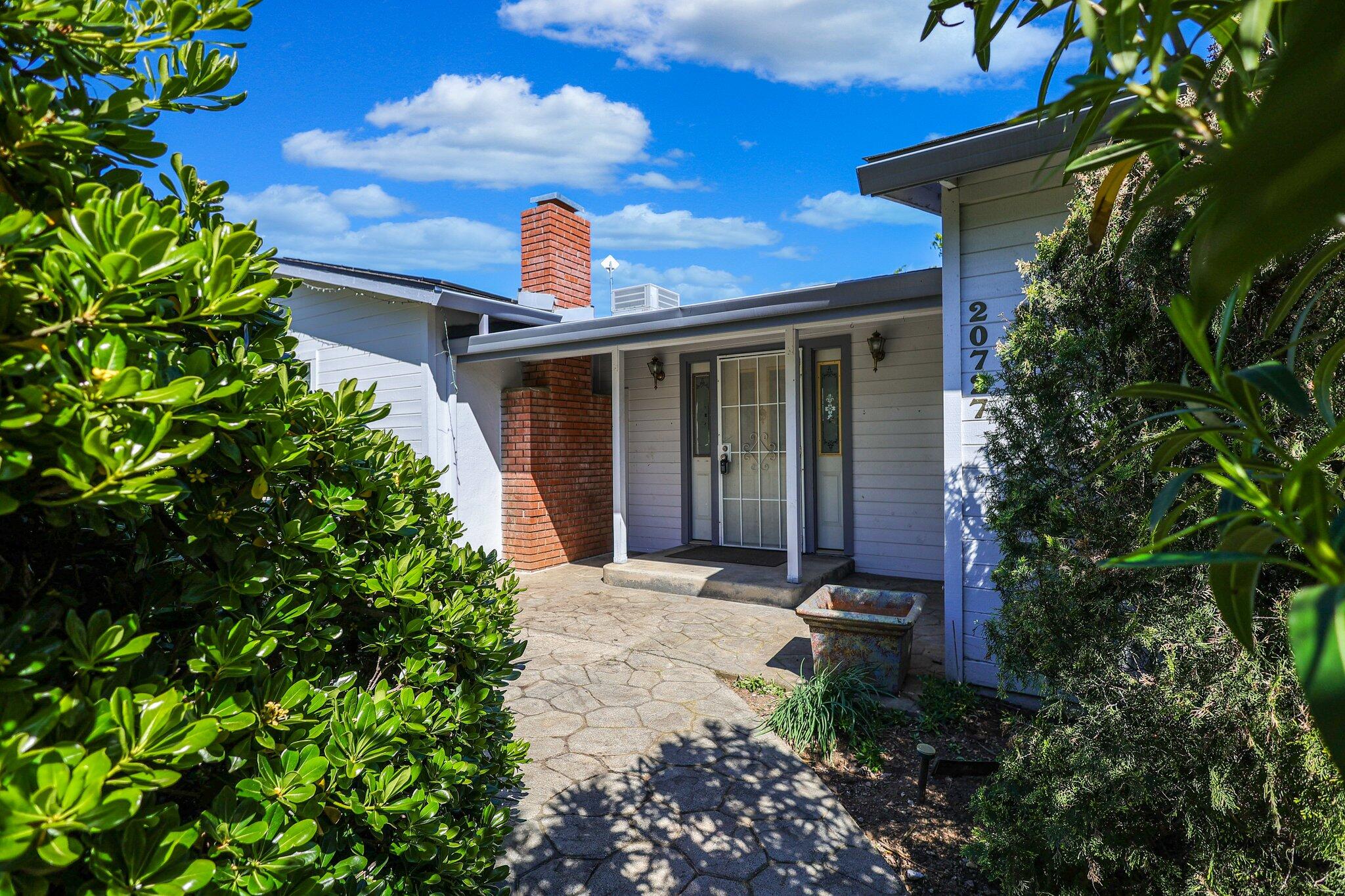 20727 Old Alturas Road Redding, CA 96003 - Photo 2 of 32 a front view of a house with a yard